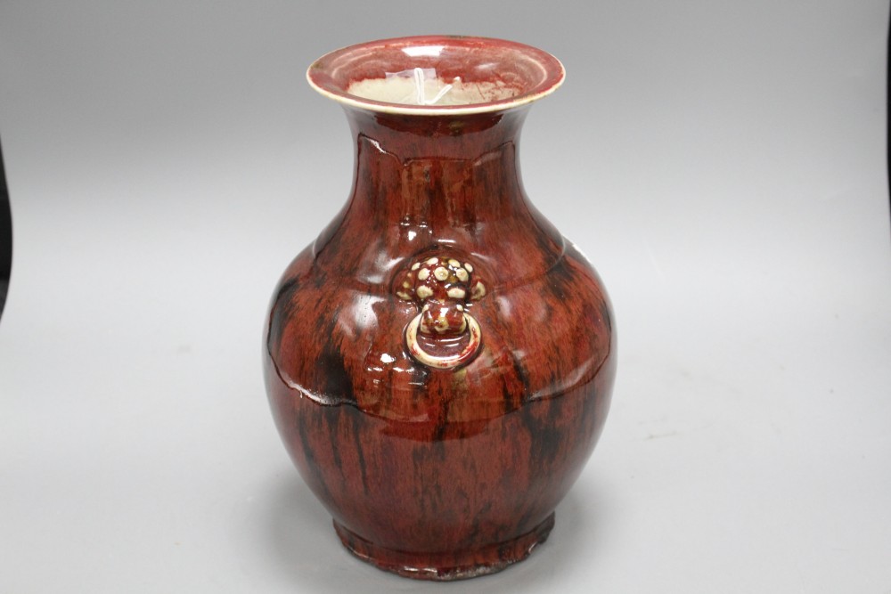 A Chinese flambe vase, with lion mask ring handles to the shoulder, H. 28.5cm